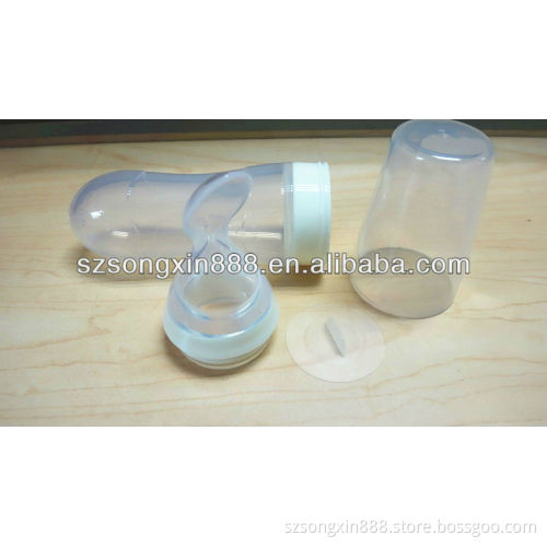Squeeze baby bottle with spoon in silicone